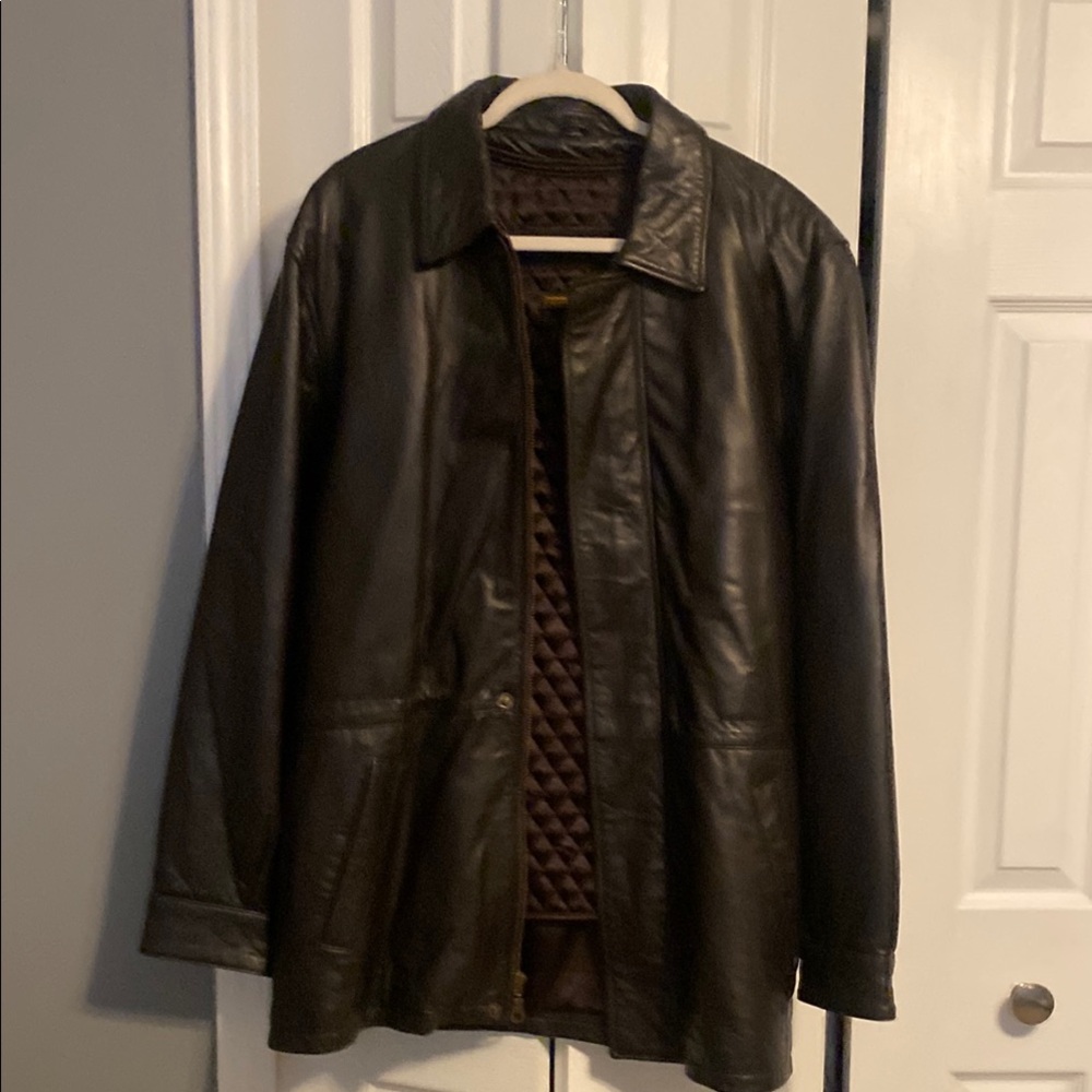 Like new dark brown leather jacket.  Stadium coat style with zip out lining!